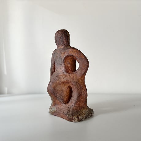 object crouching 70s