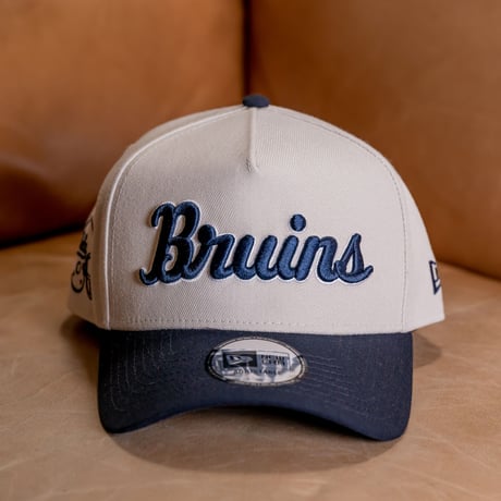 NEW ERA・ニューエラ　 9FORTY A-Frame UCLA Bruins ブルーインズ　ストーン × ネイビー スノーホワイト ネイビーバイザー