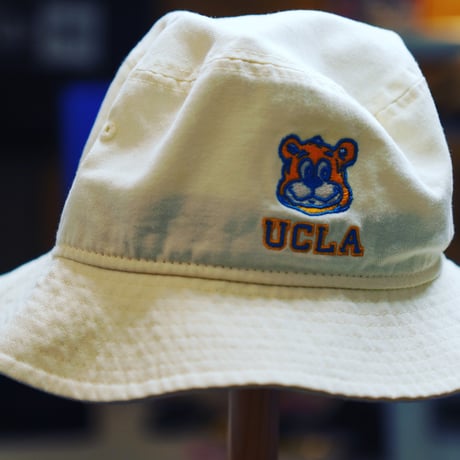 NEW ERA・ニューエラ　 バケット01 UCLA JOE ジョー ロゴ クロームホワイト × メリットゴールド マリンブルー スノーホワイト（M/L）