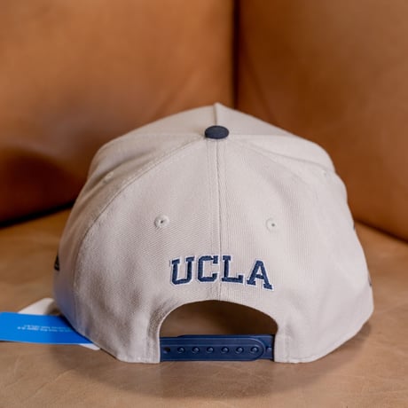 NEW ERA・ニューエラ　 9FORTY A-Frame UCLA Bruins ブルーインズ　ストーン × ネイビー スノーホワイト ネイビーバイザー
