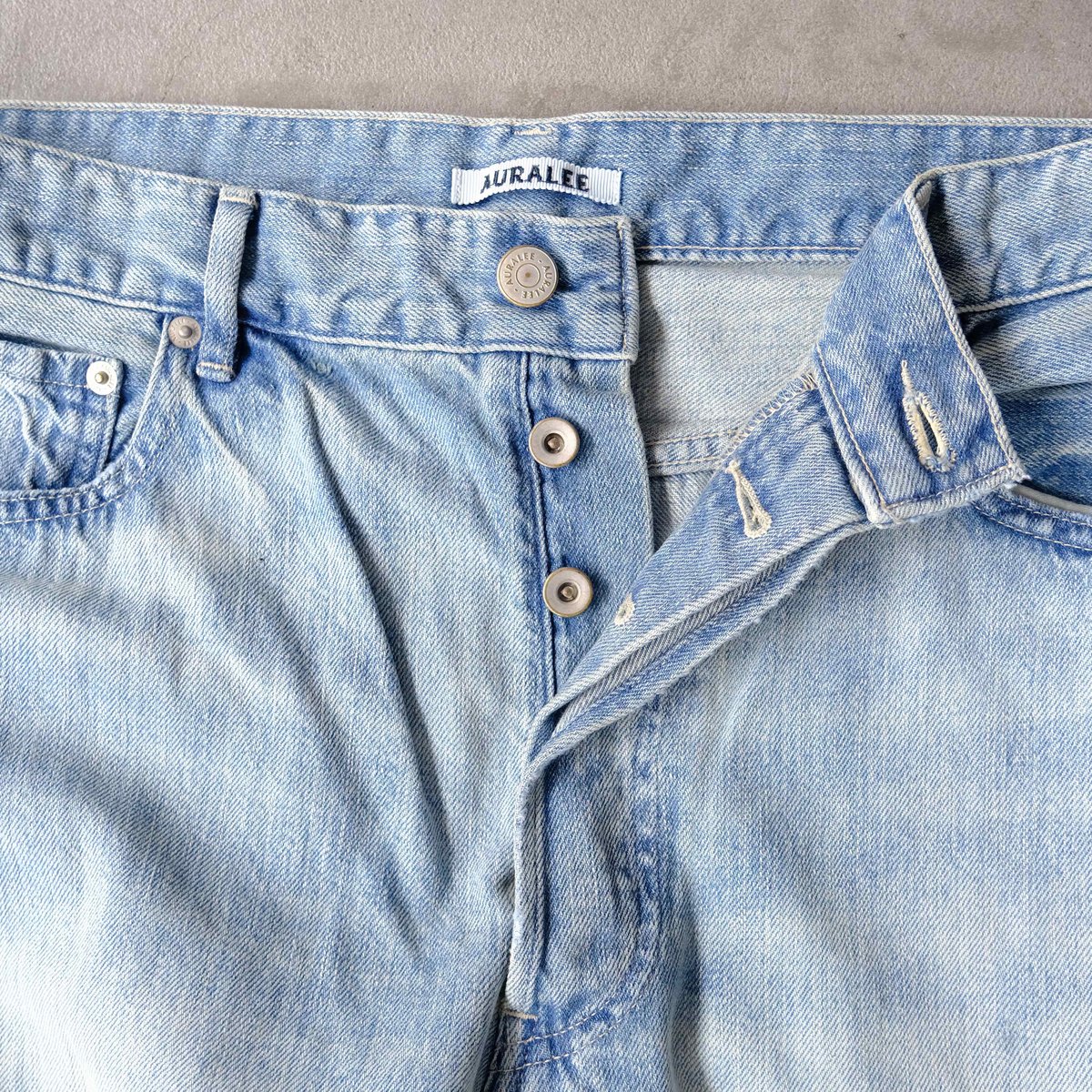 AURALEE | FADED SELVEDGE LIGHT DENIM WIDE PANTS