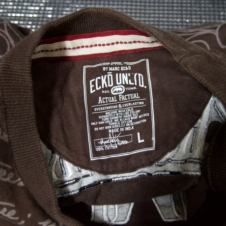 Ecko Unltd Stone Tablet Letters Tribal Lily Graphic Fraktur Embroidery “Single Stitches” S/S Tee