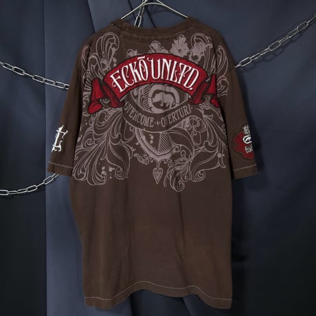Ecko Unltd Stone Tablet Letters Tribal Lily Graphic Fraktur Embroidery “Single Stitches” S/S Tee