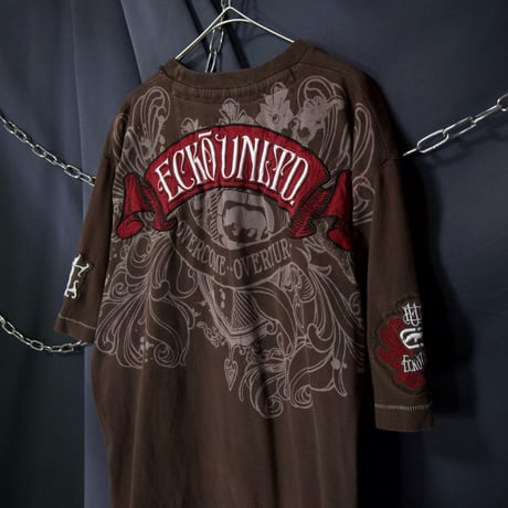 Ecko Unltd Stone Tablet Letters Tribal Lily Graphic Fraktur Embroidery “Single Stitches” S/S Tee