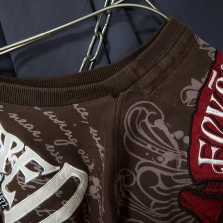 Ecko Unltd Stone Tablet Letters Tribal Lily Graphic Fraktur Embroidery “Single Stitches” S/S Tee
