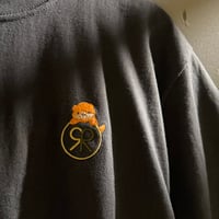 上に乗るカワウソTシャツ【サウナ好きのカワウソ×Re:】