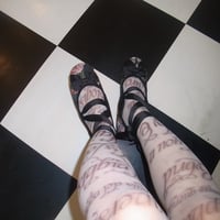 Alphabet print tights