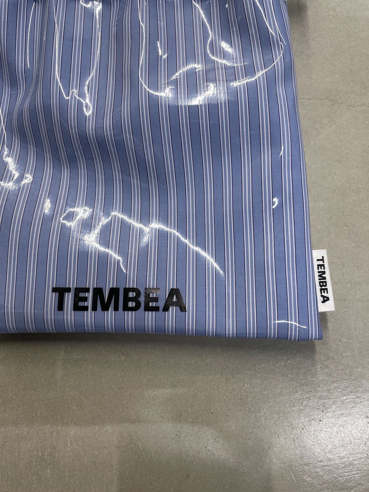 TEMBEA 巾着POCHETTE PVC COAT | niban STORE