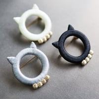 neco brooch