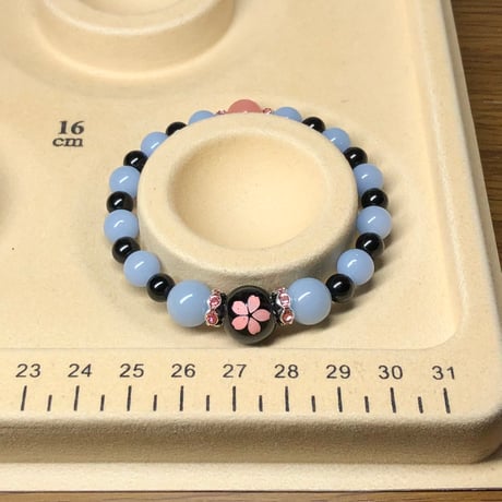 桜 ピンク彫りオニキス ルミナスストーン 夜光石 天然石ブレスレット