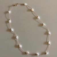 Starlight shell cord necklace