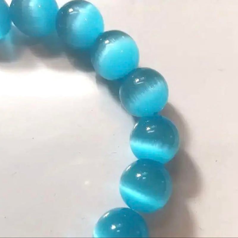 ○青色 キャッツアイ ○落ち着いたブルーの猫目石 10㎜ 内径約15.5