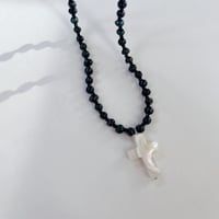 shell cross charm necklace.