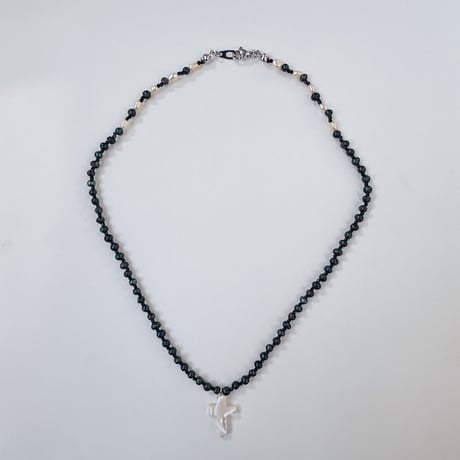 shell cross charm necklace.