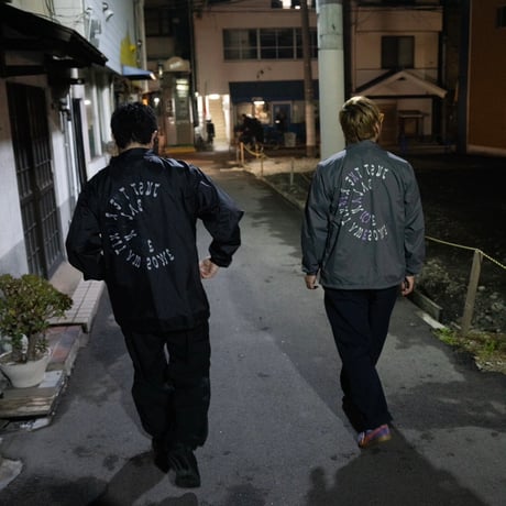 A(C) × HIGE COACH JACKET cement