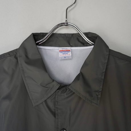 A(C) × HIGE COACH JACKET cement
