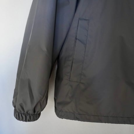 A(C) × HIGE COACH JACKET cement