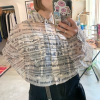 News paper like sheer shirt