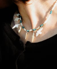 white seven birds necklace