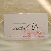 Lucky flowerのピアス_クリアピンク