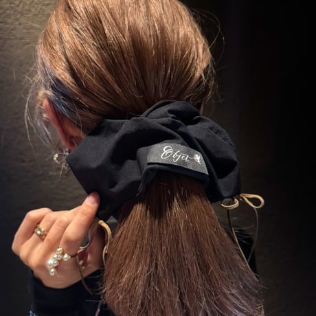 square black × camel ribbon