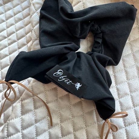 square black × camel ribbon