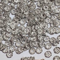 【62】100個100円・ロンデル・波形・約8mm・クリア×シルバーカラー