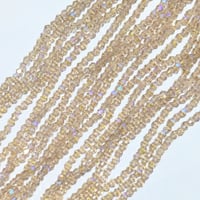 【125-1】1連約38cm370円・ガラスビーズ・電気メッキ・そろばん型・シャンパンゴールドオーロラカラー