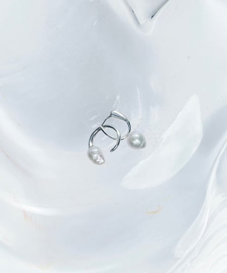 Aging baroque pearl pierce pair silver