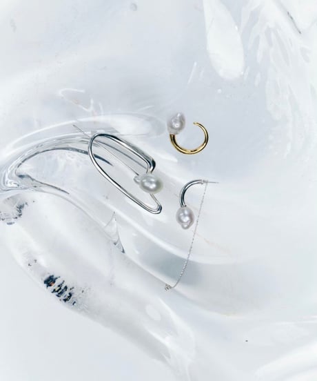 Aging baroque pearl brooch silver