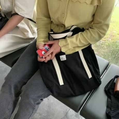 white on black tote bag