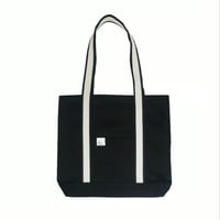 white on black tote bag