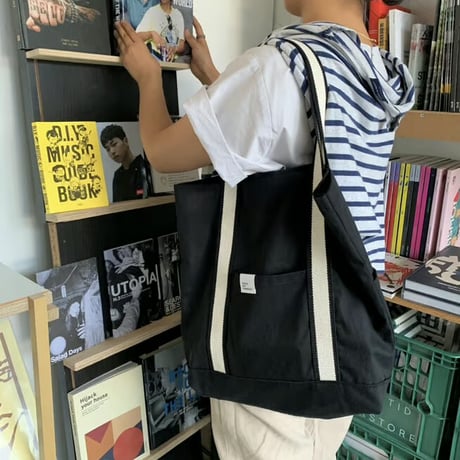 white on black tote bag