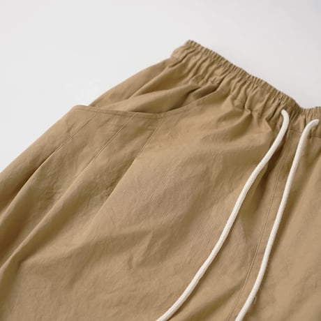 WANTHEM｜LOOSE SHIFT PLEATED PANTS WASHER BEIGE