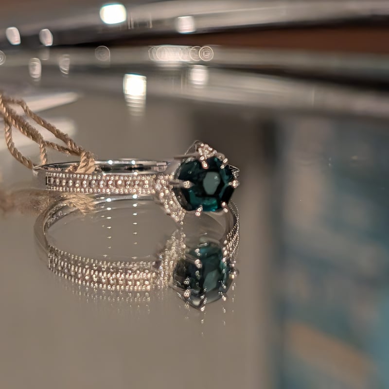 PT900トラピッチェエメラルド 0.593ct ダイヤモンド0.04ct リング