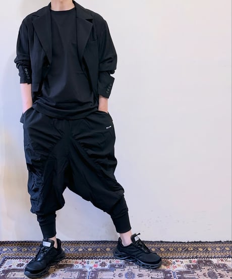 GLIMCLAP ストレッチナイロンシャーリングサルエルパンツ 054