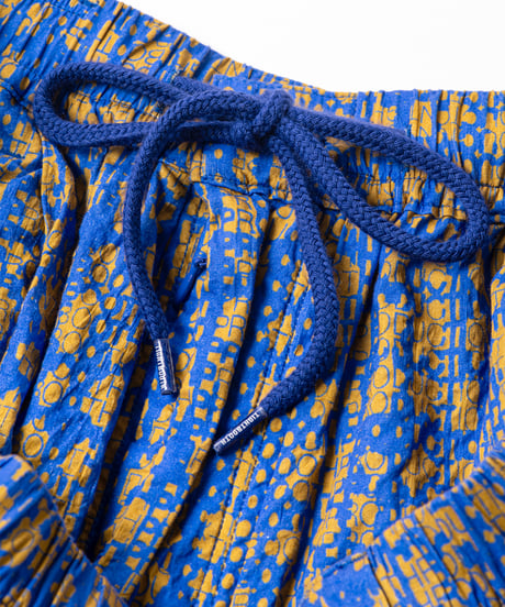 TIGHTBOOTH | BLEEDING LOGO BALLOON PANTS | Blue x Mustard