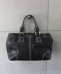 stitched hand bag