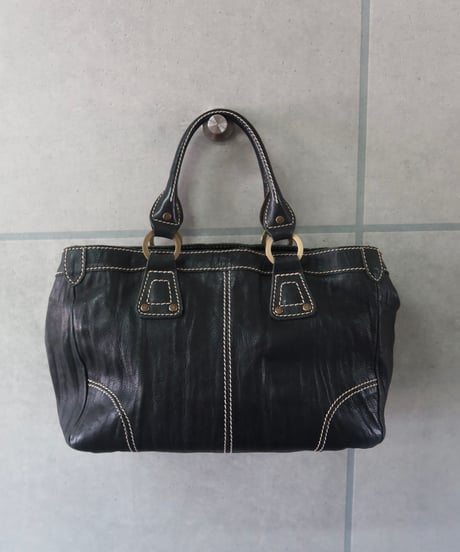 stitched hand bag
