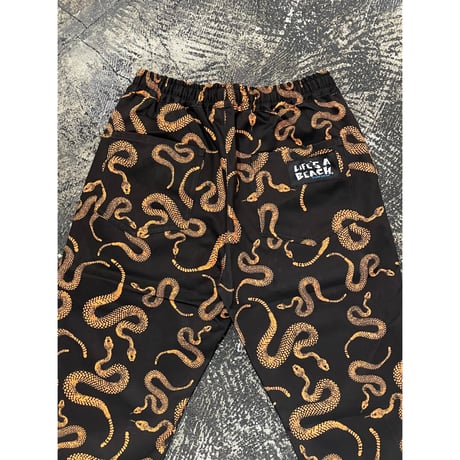 【 LIFE’S A BEACH 】“SNAKE” PANTS ( BLACK × ORANGE )