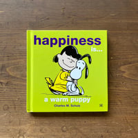 Happiness is...a warm puppy / Charles M Schulz