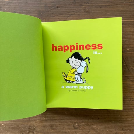 Happiness is...a warm puppy / Charles M Schulz