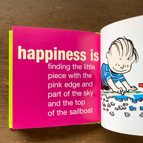 Happiness is...a warm puppy / Charles M Schulz