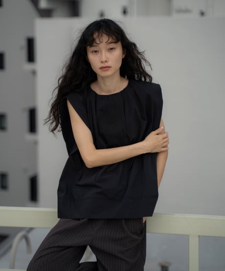 tucked shoulder sleeveless blouse