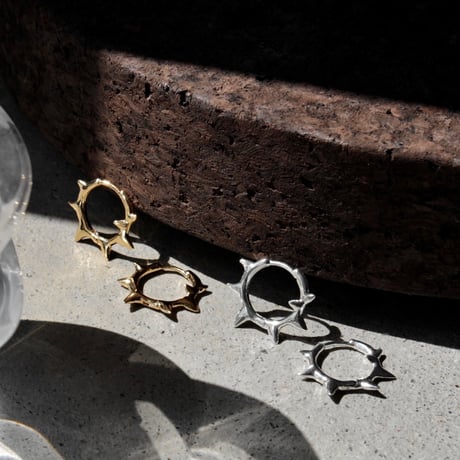 Raw edge hoop pierce