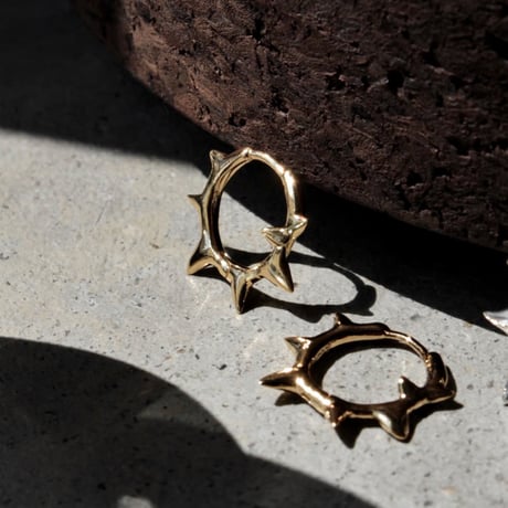 Raw edge hoop pierce