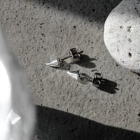 Raw edge spike pierce