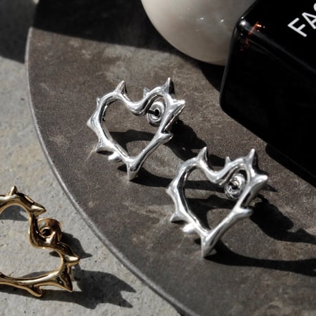 Raw edge heart pierce
