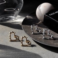 Raw edge heart pierce