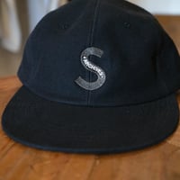 SOURCE - S CAP